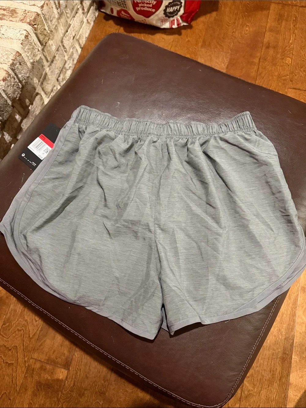 Nike Women's Light Gray Athletic Shorts with Swoosh